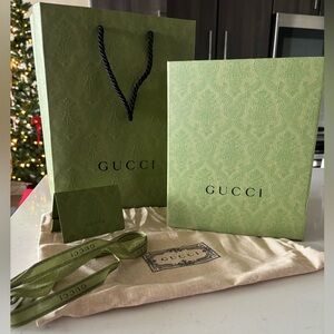 Authentic Gucci packaging. Box, bow, dust bag, receipt holder and bag.